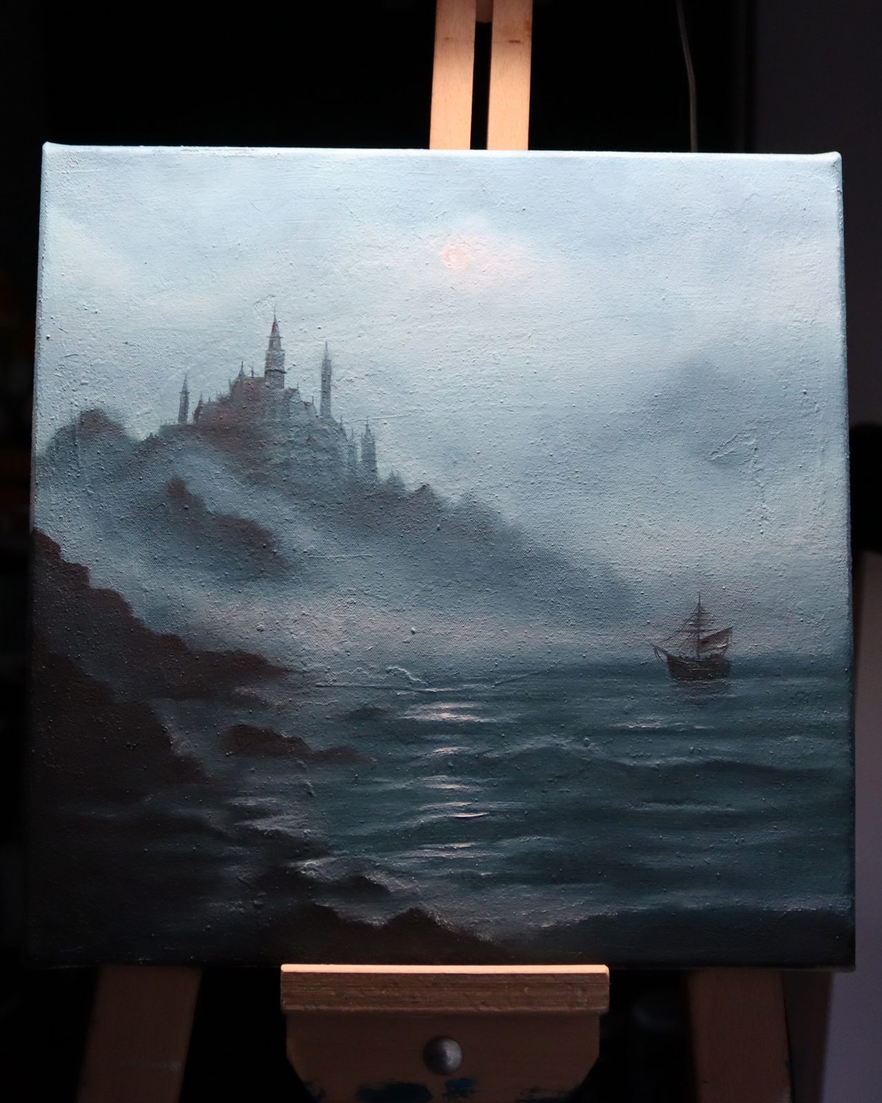 Misty Castle by the Sea with Sailing Ship Seascape Oil Painting — A spired castle rises from the mist by the sea as an old tall ship sails through the fog