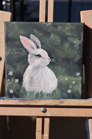 White Rabbit in a Meadow Mini Oil Painting — A white bunny resting among daisies in a green meadow